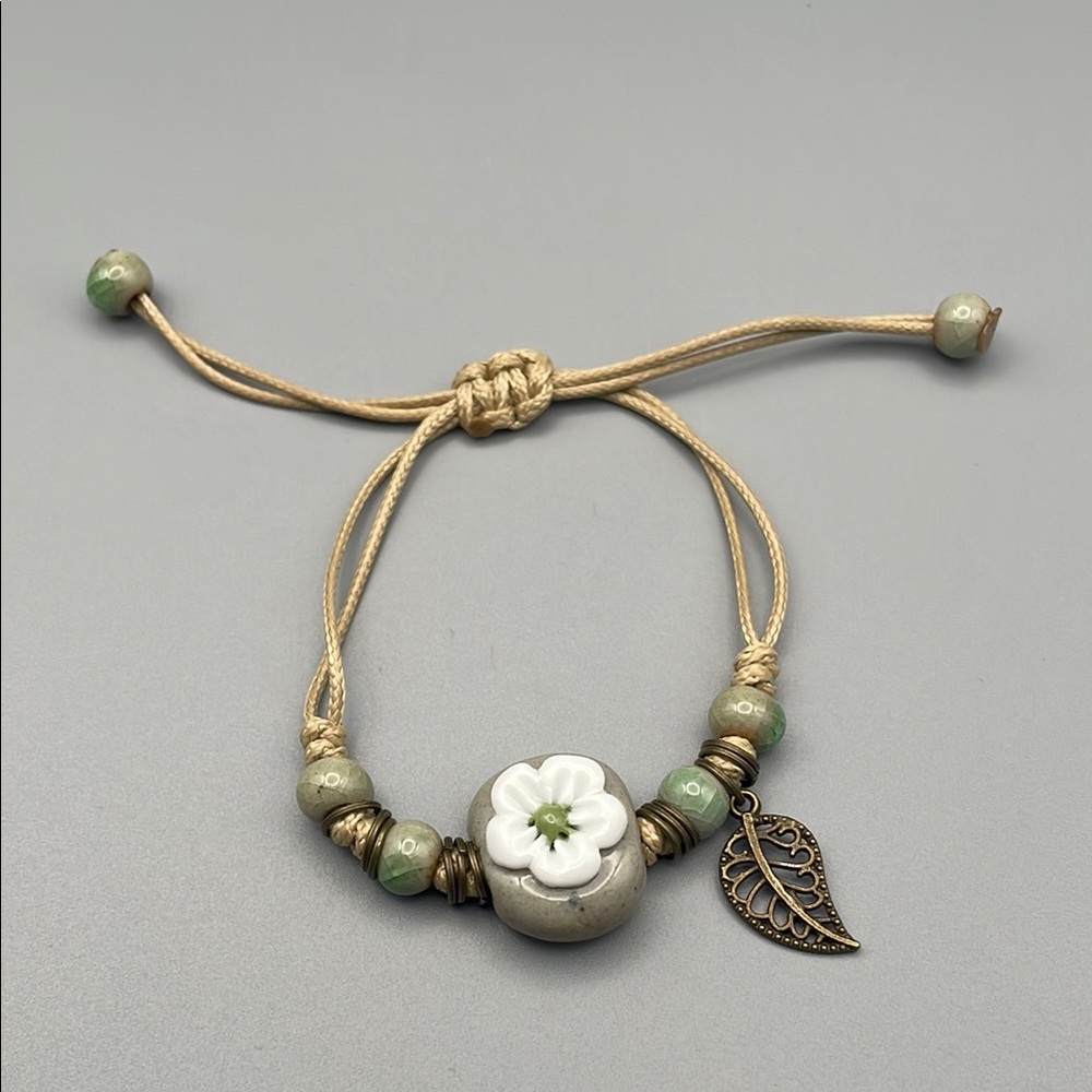 Green and Tan Bohemian Bracelet with Charms - Picture 1 of 6